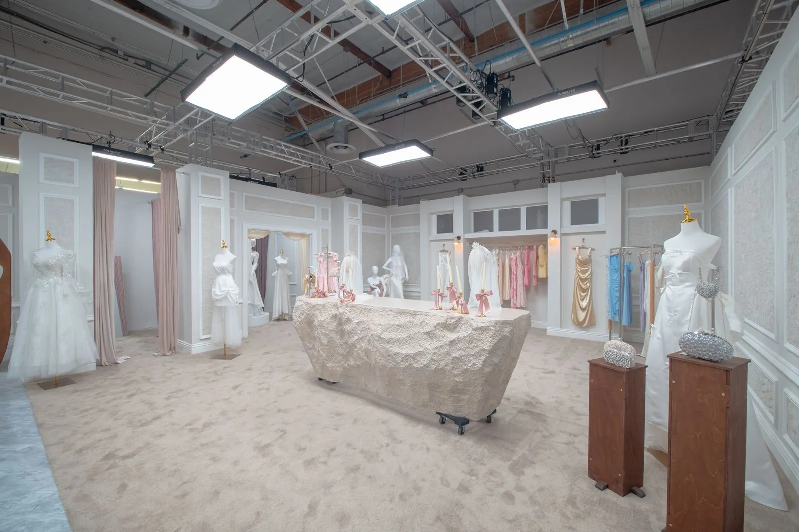 Wide view of the bridal shop, gowns and storefront windows