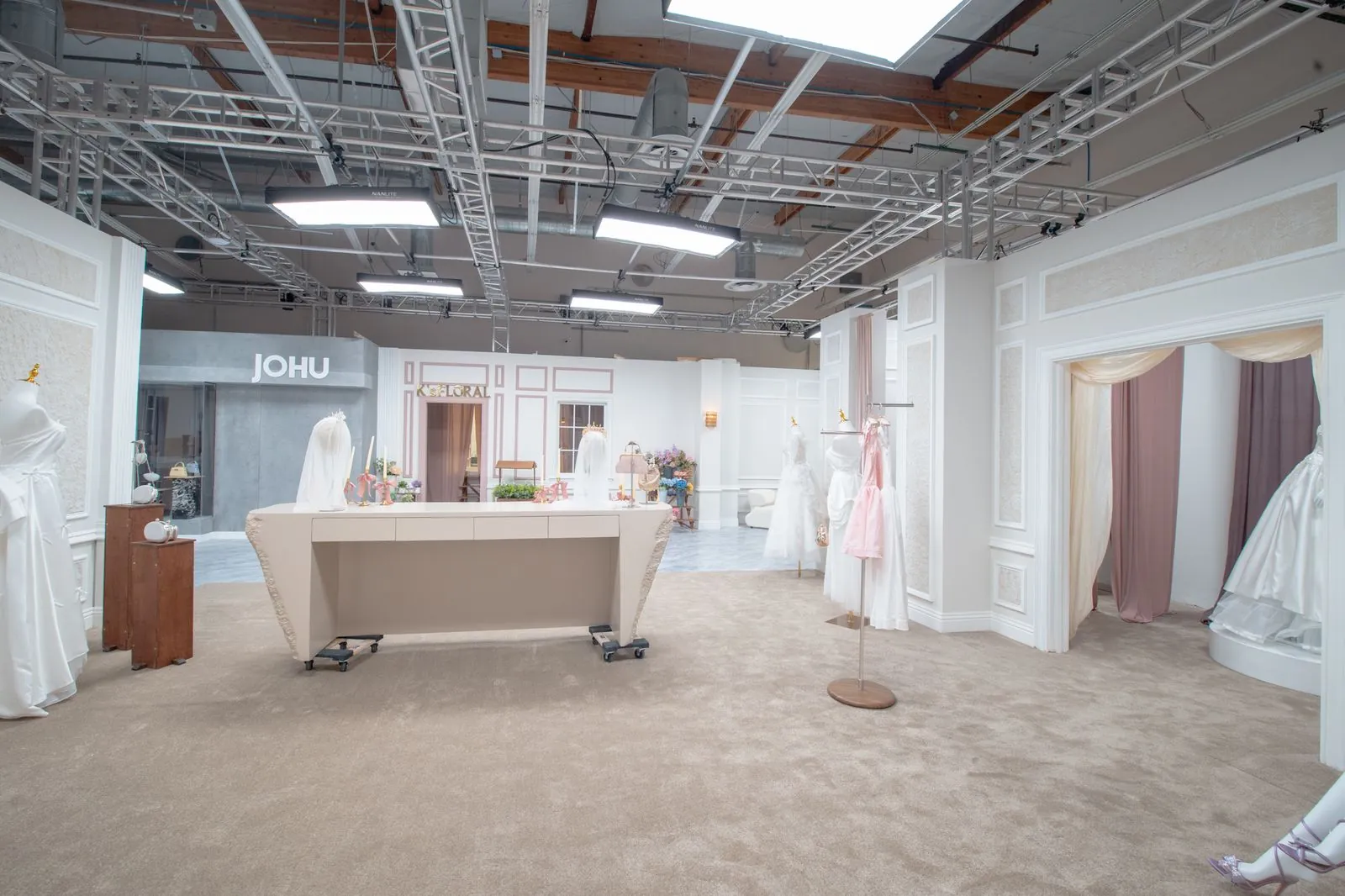 Bridal shop interior with display table and storefront signage