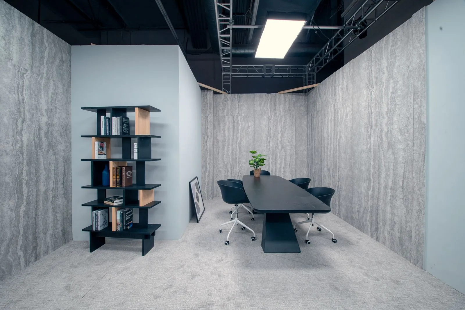 Conference room of the office set, bookcase and travertine backing