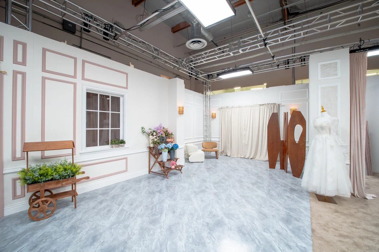 Fitting area of the bridal shop with bench and floral dressing