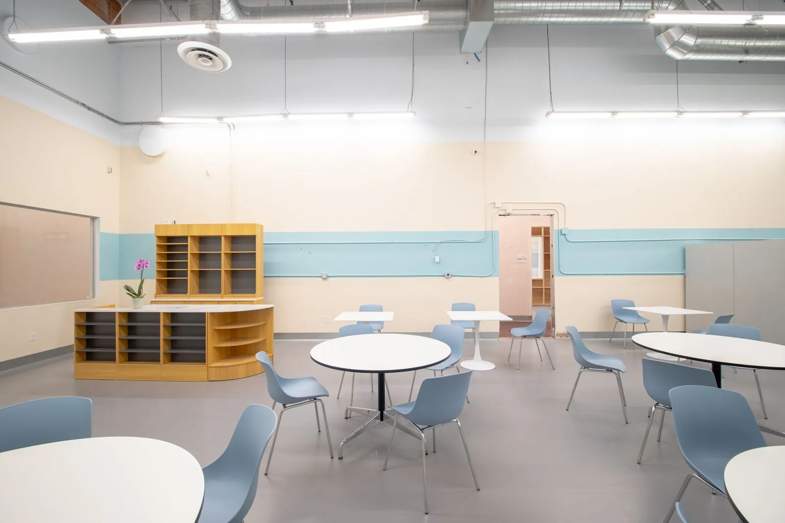 Cafeteria seating and the wood serving counter